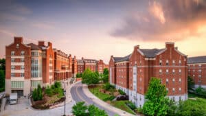 what does a property management company do? apartment complex shown at sunset