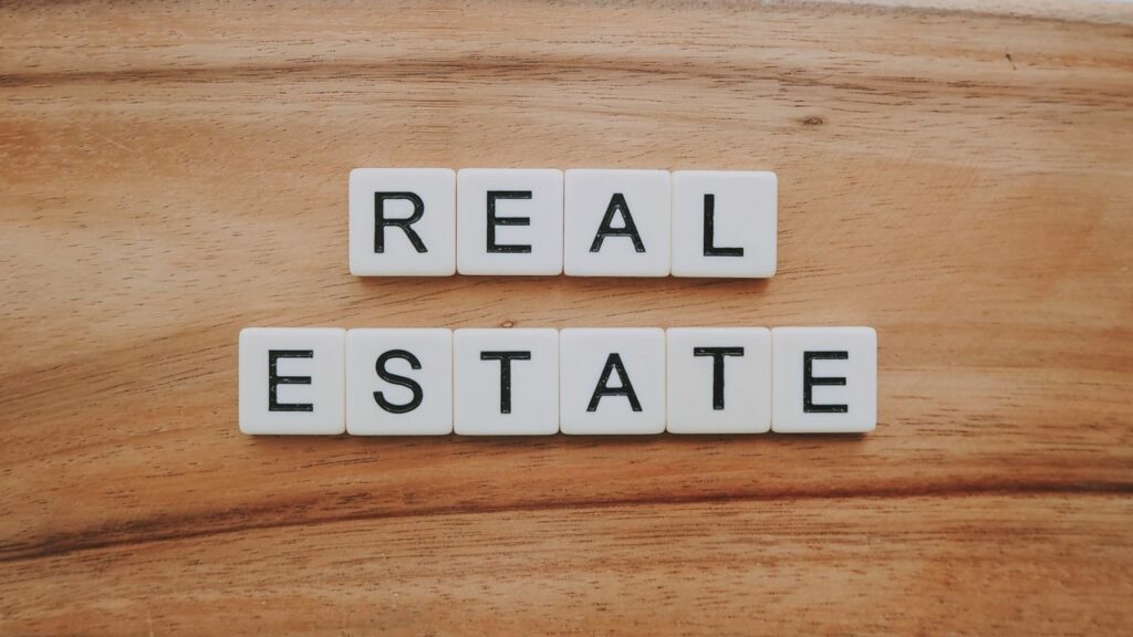 Real Estate spelled in tile