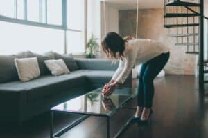 Women places decor on table