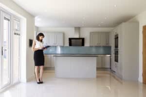 Female Realtor Looking at Lease in Kitchen