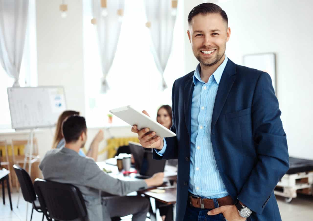 Businessman using his tablet in office