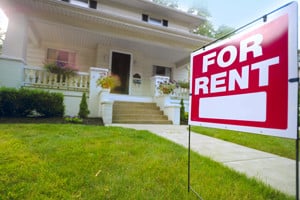 For rent sign in front of house