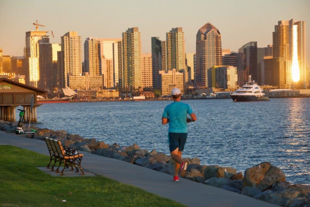 man running along San Diego Harbor Island - moving day countdown