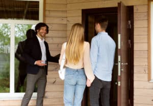 Property manager showing a house to potential buyers