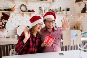 a couple during the holiday season virtually meeting with a prospective realtor