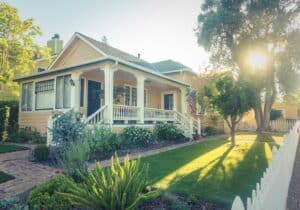 Yellow accented home with a porch